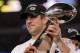 ARLINGTON, TX - FEBRUARY 06: MVP Aaron Rodgers #12 of the Green Bay Packers holds up The Vince Lombardi Trophy after the Green Bay Packers defeated the Pittsburgh Steelers 31 to 25 in Super Bowl XLV at Cowboys Stadium on February 6, 2011 in Arlington, Texas. (Photo by Doug Pensinger/Getty Images)