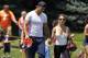 Denver Broncos wide receivr Eric Decker, left, walks off the practice field with his wife, country singer Jessie James, after a session at NFL football training camp in Englewood, Colo., on Friday, Aug. 2, 2013. (AP Photo/David Zalubowski)