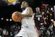 Comedian Kevin Hart (1) beats Olympic gold medalist Usain Bolt (4) to the basket in a race in the first quarter of the NBA All-Stars celebrity basketball game on Friday, Feb. 15, 2013, in Houston. (AP Photo/Pat Sullivan)