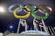 Russian dancers who will be performing at the opening ceremony pose with the Olympic rings as their friend photographs them, ahead of the 2014 Winter Olympics, Thursday, Feb. 6, 2014, in Sochi, Russia. (AP Photo/Wong Maye-E)
