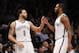 Brooklyn Nets' Deron Williams (8) celebrates with teammate Alan Anderson during the second half of an NBA basketball game against the San Antonio Spurs, Thursday, Feb. 6, 2014, in New York. Brooklyn won 103-89. (AP Photo/Jason DeCrow)