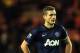 Manchester United's captain Nemanja Vidic stands dejected after being defeated by Sunderland at the end of their English League Cup semifinal first leg soccer match at the Stadium of Light, Sunderland, England, Tuesday, Jan. 7, 2014. (AP Photo/Scott Heppell)