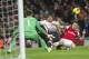 Liverpool's Luis Suárez tries to score past Arsenal's Wojciech Szczesny (left) and Laurent Koscielny (right) during their English Premier League soccer match, at the Emirates Stadium, in London, Saturday, Nov. 2, 2013. (AP Photo/Bogdan Maran)