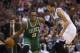 Boston Celtics' Rajon Rondo, left, looks to make his move on Philadelphia 76ers' Michael Carter-Williams, right during the second half of an NBA basketball game, Wednesday, Feb. 5, 2014, in Philadelphia. The Celtics won 114-108. (AP Photo/Chris Szagola)