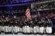 Todd Lodwick of the United States carries the national flag as he leads his team into the stadium during the opening ceremony of the 2014 Winter Olympics in Sochi, Russia, Friday, Feb. 7, 2014. (AP Photo/Patrick Semansky)