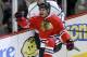 Chicago Blackhawks left wing Brandon Saad (20) celebrates his goal as Los Angeles Kings center Mike Richards skates behind during the first period of an NHL hockey game Monday, Dec. 30, 2013, in Chicago. (AP Photo/Charles Rex Arbogast)