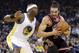 Chicago Bulls' Joakim Noah (13) dribbles next to Golden State Warriors' Jermaine O'Neal (7) during the first half of an NBA basketball game, Thursday, Feb. 6, 2014, in Oakland, Calif. (AP Photo/Marcio Jose Sanchez)