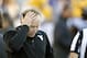 West Virginia coach Dana Holgorsen holds his head during the second half of an NCAA college football game against Kansas State in Manhattan, Kan., Saturday, Oct. 26, 2013. Kansas State won 35-12. (AP Photo/Orlin Wagner)