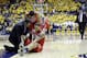 In this Saturday, Feb. 1, 2014, photo Arizona's Brandon Ashley, seated, receives attention after an injury, while teammate Nick Johnson (13) watches during an NCAA college basketball game against California in Berkeley, Calif. Arizona coach Sean Miller is at right. Arizona now faces playing the rest of the season without one of its best, most versatile players. (AP Photo/Marcio Jose Sanchez)