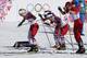 Norway's Therese Johaug, Norway's Marit Bjoergen and Poland's Justyna Kowalczyk, from left, start the women's 15k skiathlon at the 2014 Winter Olympics, Saturday, Feb. 8, 2014, in Krasnaya Polyana, Russia. (AP Photo/Dmitry Lovetsky)