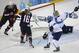 Kelli Stack of the Untied States (16) scores a goal on an assist from Hilary Knight (21) of the Untied States as Goalkeeper Noora Raty of Finland tries to block the shot during the second period of the 2014 Winter Olympics women's ice hockey match at Shayba Arena, Saturday, Feb. 8, 2014, in Sochi, Russia. (AP Photo/David J. Phillip)