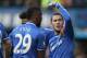 Chelsea's Eden Hazard, right, celebrates after scoring the opening goal and points towards teammate Samuel Eto'o who provided the assist during their English Premier League soccer match between Chelsea and Newcastle United in London Saturday, Feb 8 2014. (AP Photo/Alastair Grant)