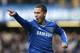 Chelsea's Eden Hazard celebrates after scoring the opening goal during their English Premier League soccer match between Chelsea and Newcastle United in London, Saturday, Feb. 8 2014. (AP Photo/Alastair Grant)