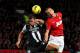 MANCHESTER, ENGLAND - NOVEMBER 26: Stephen Taylor of Newcastle United goes up for a header with Nemanja Vidic of Manchester United during the Barclays Premier League match between Manchester United and Newcastle United at Old Trafford on November 26, 2011 in Manchester, England. (Photo by Alex Livesey/Getty Images)