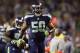 Sep 15, 2013; Seattle, WA, USA; Seattle Seahawks outside linebacker K.J. Wright (50) celebrates after recovering a fumble against the San Francisco 49ers during the second quarter at CenturyLink Field. Mandatory Credit: Joe Nicholson-USA TODAY Sports