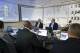 This photo provided by the Denver Broncos shows head coach John Fox, back left, and vice president John Elway, center facing camera, in the