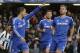 Chelsea's Eden Hazard, left, celebrates his penalty goal against Newcastle United with teammates during their English Premier League soccer match at Stamford Bridge, London, Saturday, Feb. 8, 2014. (AP Photo/Sang Tan)