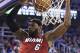 Miami Heat's LeBron James (6) dunks against the Utah Jazz in the second quarter of an NBA basketball game Saturday, Feb. 8, 2014, in Salt Lake City. (AP Photo/Rick Bowmer)