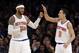 New York Knicks' Carmelo Anthony (7) celebrates with Pablo Prigioni (9) during the second half of an NBA basketball game against the Denver Nuggets on Friday, Feb. 7, 2014, in New York. The Knicks won 117-90. (AP Photo/Frank Franklin II)