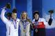 Silver medalist Staale Sandbech, left, of Norway, gold medalist Sage Kotsenburg, of the United States, center, and bronze medalist Mark McMorris, right, of Canada, pose on the podium during the medal ceremony for the Snowboard Men's Slopestyle competition at the 2014 Winter Olympics, Saturday, Feb. 8, 2014, in Sochi, Russia. (AP Photo/David J. Phillip )