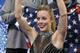 Ashley Wagner of the United States waves to spectators as she waits for her results after competing in the women's team short program figure skating competition at the Iceberg Skating Palace during the 2014 Winter Olympics, Saturday, Feb. 8, 2014, in Sochi, Russia. (AP Photo/Darron Cummings, Pool)