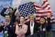Meryl Davis and Charlie White of the United States, centre, wait for their results after competing in the team ice dance short dance figure skating competition at the Iceberg Skating Palace during the 2014 Winter Olympics, Saturday, Feb. 8, 2014, in Sochi, Russia. (AP Photo/Darron Cummings, Pool)