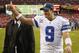 Dallas Cowboys quarterback Tony Romo flashes a thumbs-up as he walks off the field after the Cowboys defeated the Washington Redsksins 24-23 in an NFL football game in Landover, Md., Sunday, Dec. 22, 2013. (AP Photo/Evan Vucci)