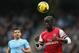 MANCHESTER, ENGLAND - DECEMBER 14: Bacary Sagna of Arsenal in action watched by Sergio Aguero of Manchester City during the Barclays Premier League match between Manchester City and Arsenal at Etihad Stadium on December 14, 2013 in Manchester, England. (Photo by Clive Brunskill/Getty Images)