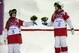 Canada's Justine Dufour-Lapointe, right, celebrates her gold medal in the women's moguls final, with her sister and silver medalist Chloe Dufour-Lapointe, left, at the Rosa Khutor Extreme Park, at the 2014 Winter Olympics, Saturday, Feb. 8, 2014, in Krasnaya Polyana, Russia. (AP Photo/Andy Wong)