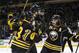 Buffalo Sabres' Tyler Ennis (63) and Matt Moulson (26) celebrate with Tyler Myers, center, after Myers scored a goal against the Columbus Blue Jackets during the first period of an NHL hockey game in Buffalo, N.Y., Saturday, Jan. 18, 2014. (AP Photo/Gary Wiepert)