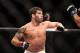 Raphael Assuncao, left, in action against Mike Easton during a mixed martial arts bout at a UFC on FOX event in Seattle, Saturday, Dec. 8, 2012. Assuncao won via a 3-round unanimous decision. (AP Photo/Gregory Payan)