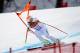 SOCHI, RUSSIA - FEBRUARY 09: Bode Miller of the United Stated hits the gate during the Alpine Skiing Men's Downhill on day 2 of the Sochi 2014 Winter Olympics at Rosa Khutor Alpine Center on February 9, 2014 in Sochi, Russia. (Photo by Ezra Shaw/Getty Images)