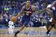 Atlanta Hawks point guard Jeff Teague (0) drives past Orlando Magic shooting guard Victor Oladipo, right, during the second half of an NBA basketball game in Orlando, Fla., Wednesday, Jan. 22, 2014. The Hawks won 112-109.(AP Photo/Phelan M. Ebenhack)