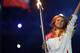 Maria Sharapova carries the Olympic torch into the stadium during Opening Ceremonies of 2014 Olympic Winter Games.
