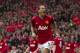 Manchester United's Rio Ferdinand celebrates after scoring against Swansea City during their English Premier League soccer match at Old Trafford Stadium, Manchester, England, Sunday May 12, 2013. (AP Photo/Jon Super)