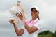 Cheyenne Woods holds the winners' trophy for the Australian Ladies Masters.