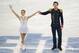 Tatiana Volosozhar and Maxim Trankov of Russia complete their routine in the pairs short program figure skating competition at the Iceberg Skating Palace during the 2014 Winter Olympics, Tuesday, Feb. 11, 2014, in Sochi, Russia. (AP Photo/Bernat Armangue)