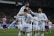 Real's Cristiano Ronaldo, center no. 7, celebrates his goal with teammates during a semifinal, 2nd leg, Copa del Rey soccer match between Atletico de Madrid and Real Madrid at the Vicente Calderon stadium in Madrid, Spain, Tuesday Feb. 11, 2014. (AP Photo/Andres Kudacki)