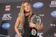 (Rowdy) Ronda Rousey shows off her UFC bantamweight championship belt, on Thursday Dec. 6, 2012. UFC president Dana White handed out the belt Thursday, saying the former Strikeforce title-holder will make her UFC debut on Feb., 23 against Liz Carmouche. (AP Photo/The Canadian Press, Neil Davidson)