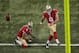 San Francisco 49ers kicker Phil Dawson (9) kicks an extra point after punter Andy Lee (4) held the ball during the third quarter of an NFL football game against the St. Louis Rams Thursday, Sept. 26, 2013, in St. Louis. (AP Photo/Charlie Riedel)