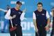 Skip John Shuster of the United States, left, talks shot strategy with teammate Jared Zezel during men's curling competition against China at the 2014 Winter Olympics, Tuesday, Feb. 11, 2014, in Sochi, Russia. (AP Photo/Robert F. Bukaty)