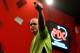 LONDON, ENGLAND - DECEMBER 30: Michael van Gerwen of The Netherlands celebrates victory after defeating Adrian Lewis of England in their semi final match on day fifteen of the Ladbrokes.com World Darts Championship at Alexandra Palace on December 30, 2013 in London, England. (Photo by Ben Hoskins/Getty Images)