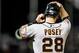 DENVER, CO - AUGUST 26: Buster Posey #28 of the San Francisco Giants stands at first base after hitting a single against the Colorado Rockies at Coors Field on August 26, 2013 in Denver, Colorado. The Rockies beat the Giants 6-1. (Photo by Dustin Bradford/Getty Images)