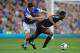 LIVERPOOL, ENGLAND - SEPTEMBER 14: John Obi Mikel of Chelsea tangles with Gareth Barry of Everton during the Barclays Premier League match between Everton and Chelsea at Goodison Park on September 14, 2013 in Liverpool, England. (Photo by Chris Brunskill/Getty Images)
