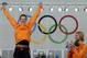 Bronze medallist Michel Mulder from the Netherlands, right, applauds country skater and gold medallist Stefan Groothuis during the flower ceremony for the men's 1000-meter speedskating race at the Adler Arena Skating Center during the 2014 Winter Olympics in Sochi, Russia, Wednesday, Feb. 12, 2014. (AP Photo/Matt Dunham)