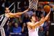 Dec 18, 2013; Phoenix, AZ, USA; Phoenix Suns guard Goran Dragic (right) takes a shot under pressure from San Antonio Spurs guard Manu Ginobili in the second quarter at US Airways Center. Mandatory Credit: Mark J. Rebilas-USA TODAY Sports