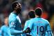 Tottenham Hotspur's Emmanuel Adebayor, left, celebrates his goal with his teammates during their English Premier League soccer match against Newcastle United at St James' Park, Newcastle, England, Wednesday, Feb. 12, 2014. (AP Photo/Scott Heppell)