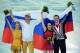 Feb 12, 2014; Sochi, RUSSIA; Tatiana Volosozhar and Maxim Trankov (RUS) (left), Ksenia Stolbova and Fedor Klimov (RUS) (right) celebrate winning the gold and silver medals, respectively, in the pairs free skate program during the Sochi 2014 Olympic Winter Games at Iceberg Skating Palace. Mandatory Credit: Kyle Terada-USA TODAY Sports