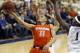 Syracuse's Tyler Ennis (11) shoots after getting past Pittsburgh's Jamel Artis (1) during the second half of an NCAA college basketball game Wednesday, Feb. 12, 2014, in Pittsburgh. (AP Photo/Keith Srakocic)