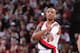 PORTLAND, OR - JANUARY 28: Damian Lillard #0 of the Portland Trail Blazers stands on the court against the Memphis Grizzlies on January 28, 2014 at the Moda Center Arena in Portland, Oregon. NOTE TO USER: User expressly acknowledges and agrees that, by downloading and or using this photograph, user is consenting to the terms and conditions of the Getty Images License Agreement. Mandatory Copyright Notice: Copyright 2014 NBAE (Photo by Sam Forencich/NBAE via Getty Images)